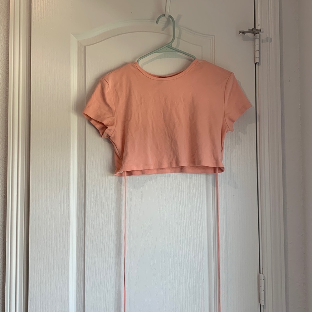 Super cropped shirt. Strings can be tied multiple ways!